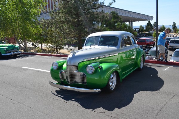 green custom hot rod coupe at car show