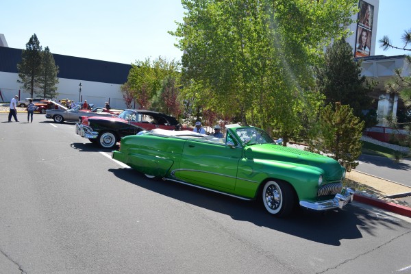 green custom hot rod convertible at car show