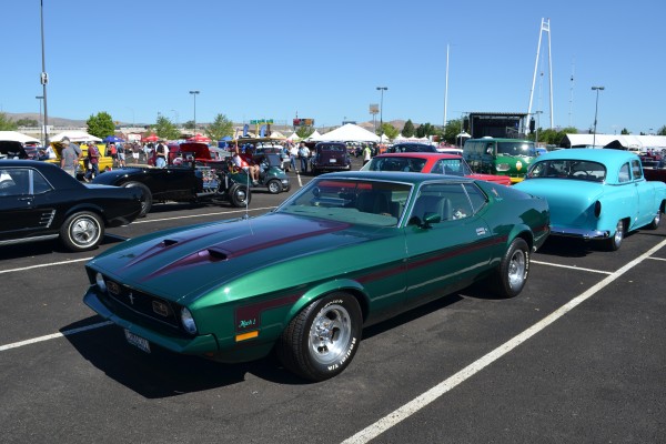 green custom ford second gen mach 1 mustang at car show