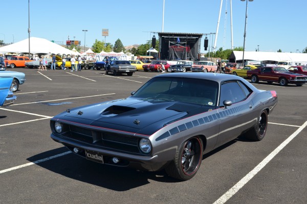 vintage customized plymouth cuda at car show cruise in