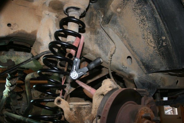 using a ratchet strap to compress col spring on a jeep cherokee xj