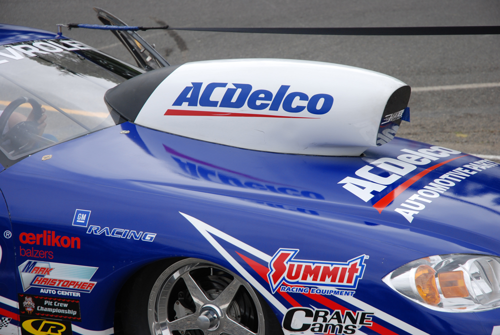 close up of a pro stock style hood scoop on a chevy dragster