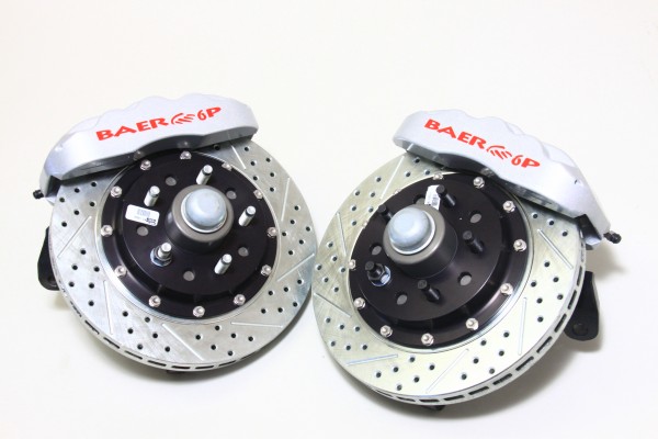 a pair of baer disc brake calipers and rotors