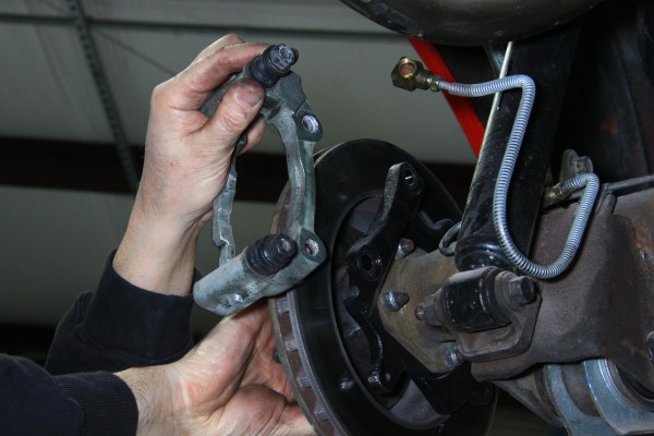 removing brake caliper mounting bracket