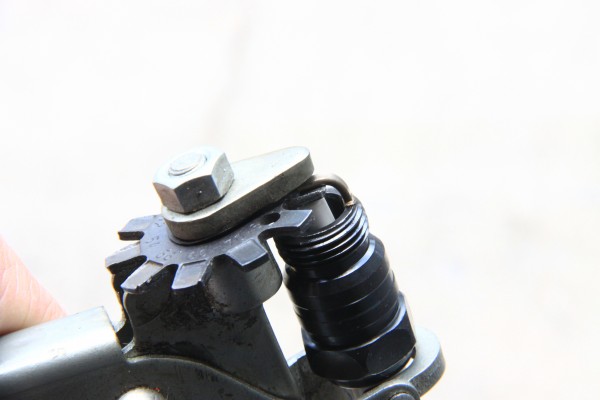 using a gapping tool to gap a spark plug