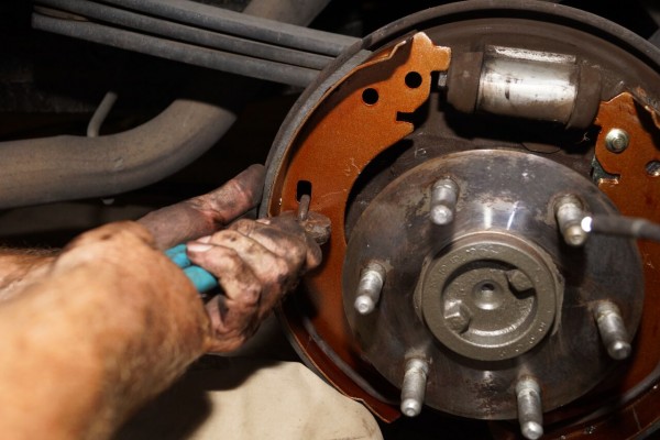 removing a brake show spring from a drum brake