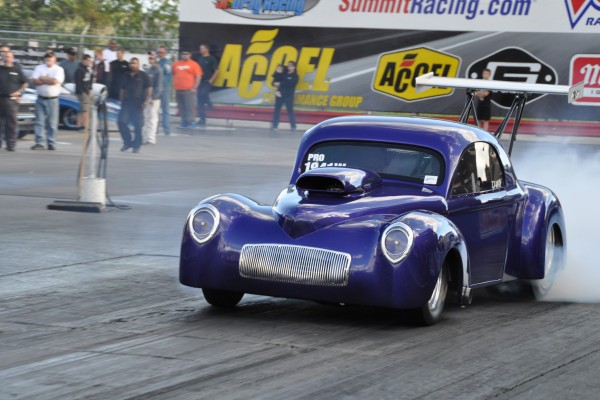 willys modified dragster doing a burnout