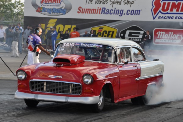 1955 chevy bel air dragster doing a burnout