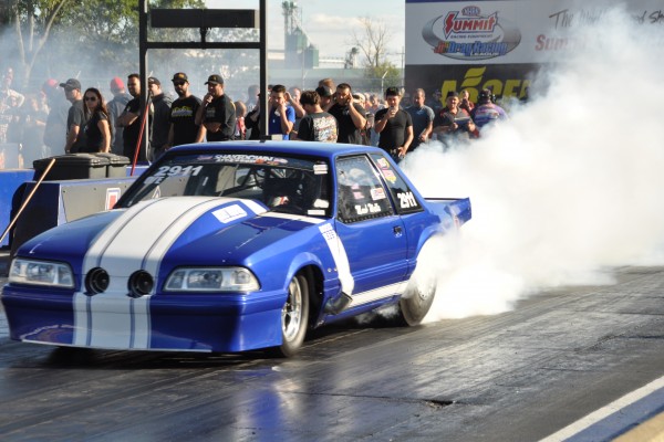 ford mustang fox body drag car doing a burnout
