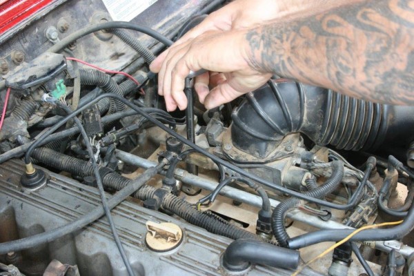 loosening bolts that hold a fuel rail on a jeep 4.0L engine