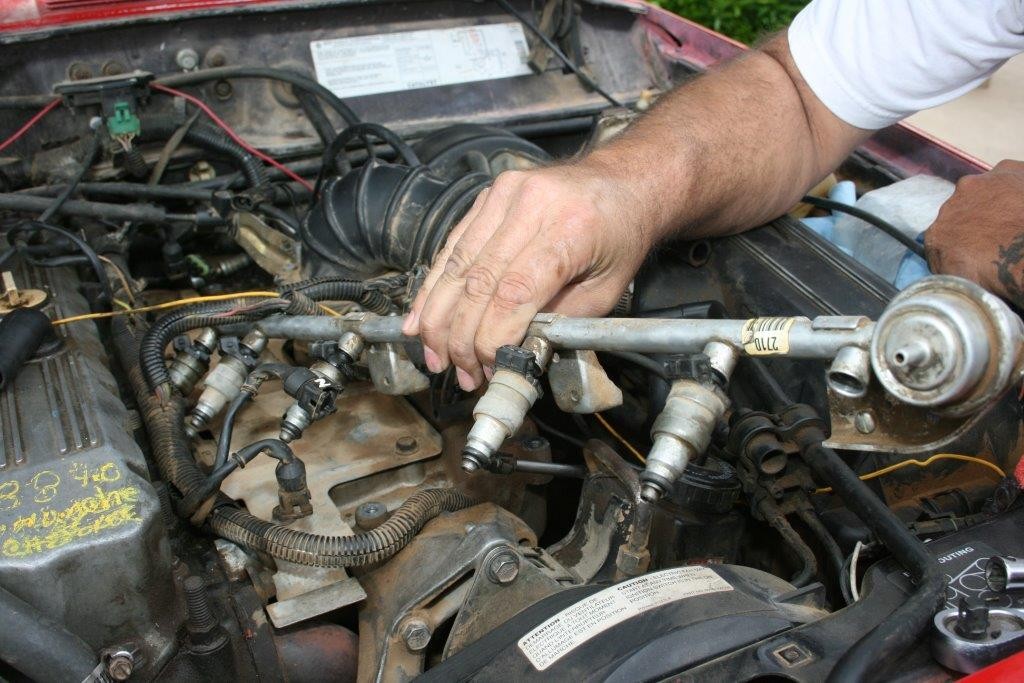removing the fuel rail from a jeep 4.0L engine