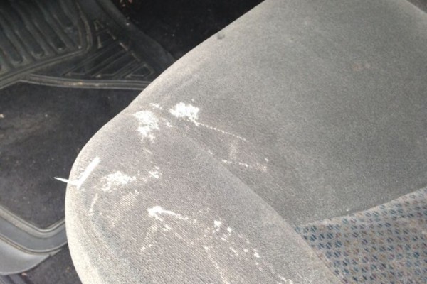 ratty stained seat of a chevy silverado truck