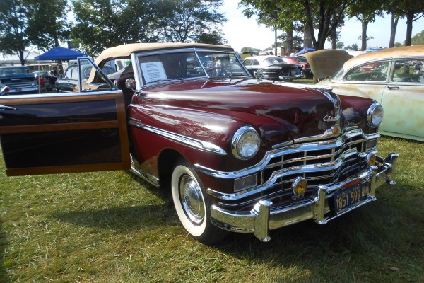 vintage Chrysler woody convertible at car show
