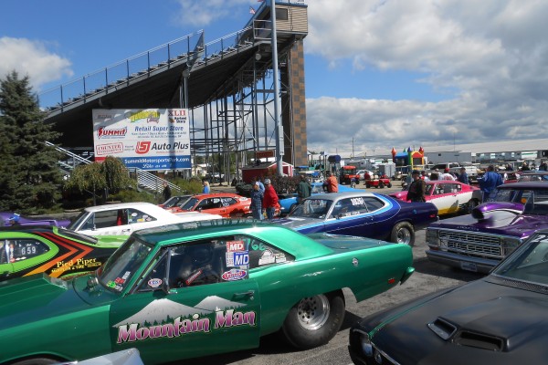 classic mopar muscle cars in staging lanes at dragstrip
