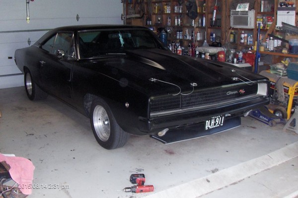 black 1968 dodge charger restomod in garage
