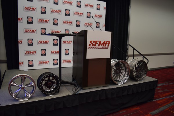 weld wheels next to podium at SEMA 2015