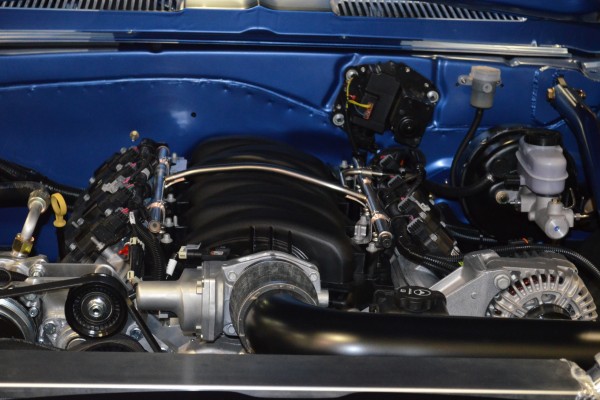 customized blue chevy camaro at sema 2015, close up engine