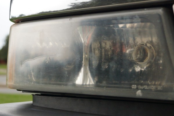 foggy damaged headlights from an old chevy Silverado