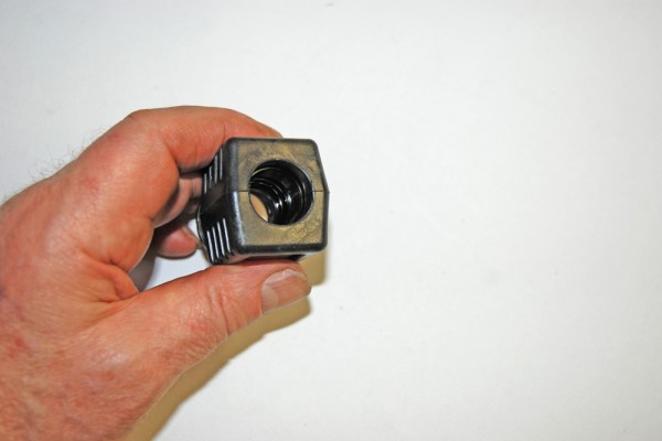 a hose fitting held by a man