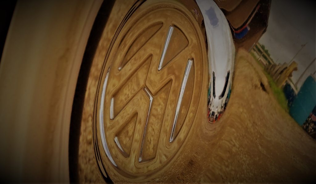 stylized close up of VW logo on a chrome Volkswagen Beetle Hubcap