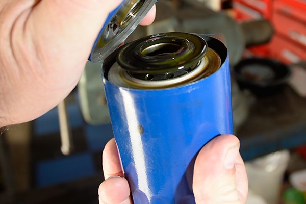 removing the top of an oil filter canister with a cutter tool