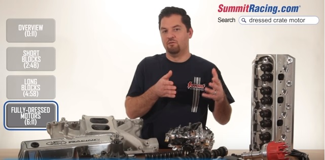 man speaking near automotive engine parts