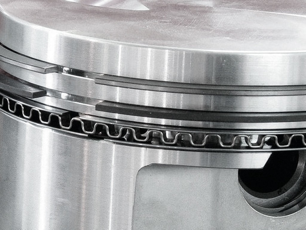 close up of piston rings on an engine piston