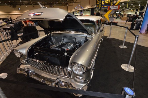 1955 tri-five chevy station wagon at indoor car show