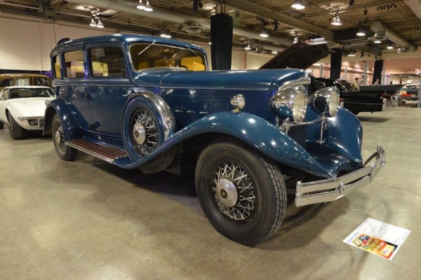 vintage touring sedan at indoor car show