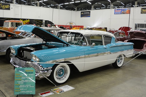 1958 chevy coupe at indoor car show