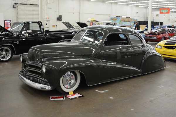 lowered hot rod coupe at indoor car show