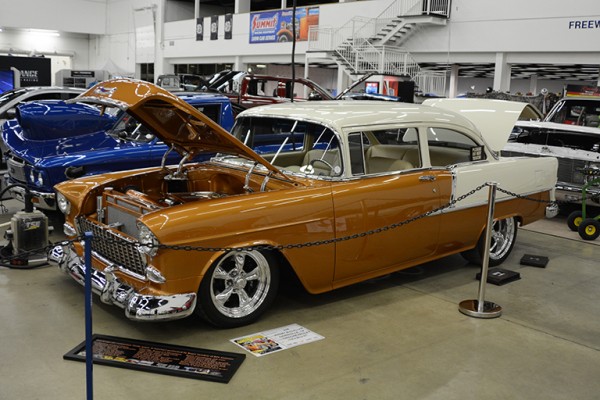 custom 1955 chevy coupe hot rod at indoor car show