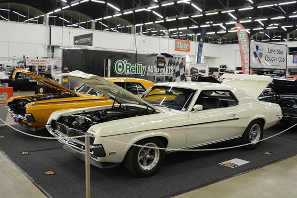 white mercury cougar muscle car at indoor car show