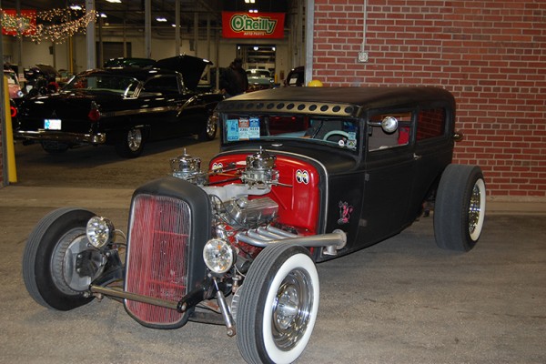 ford stretched tudor hot rod at indoor car show