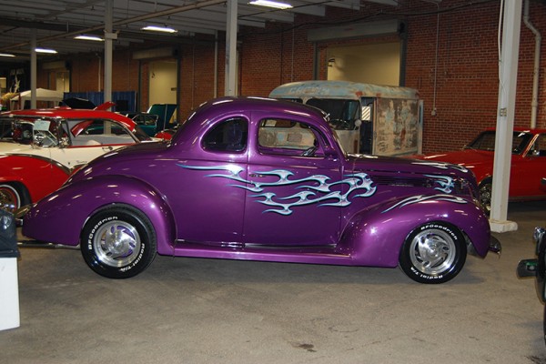 purple flamed hot rod coupe at indoor car show