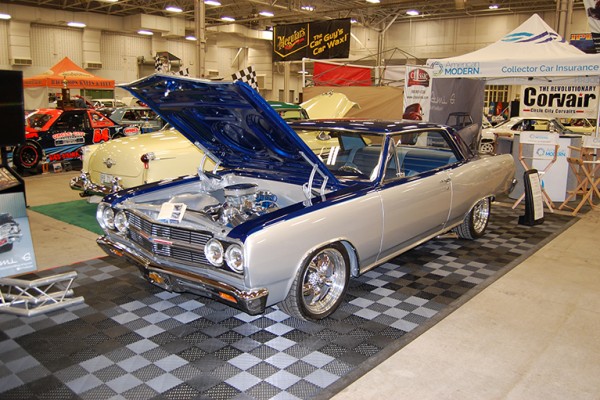 chevy chevelle coupe on display at indoor car show