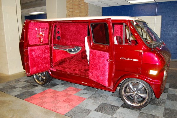 vintage custom ford econoline van at indoor car show