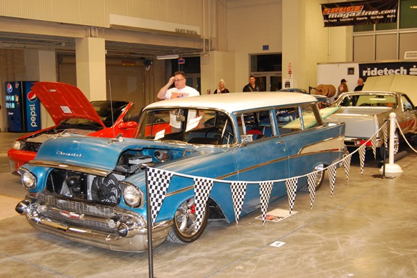 blue 1957 chevy bel air nomad wagon at indoor car show