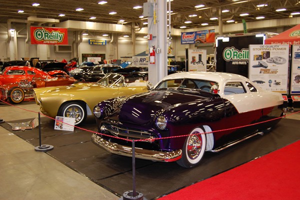 old custom cars on display at indoor car show
