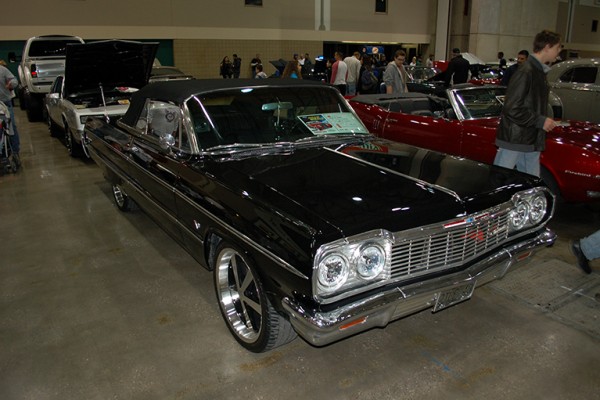 vintage chevy impala convertible at indoor car show