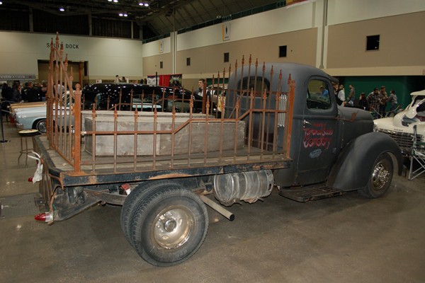 vintage stakebed truck at indoor car show