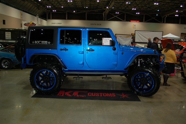 blue jeep wrangler jk at indoor car show