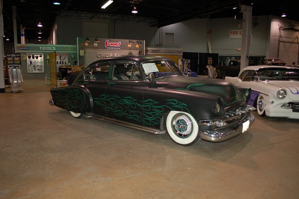 Hot rod coupe with green flames