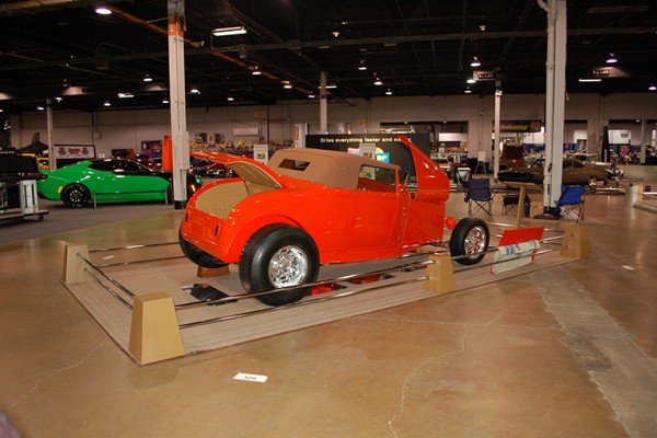 Ford roadster coupe on display at indoor car show