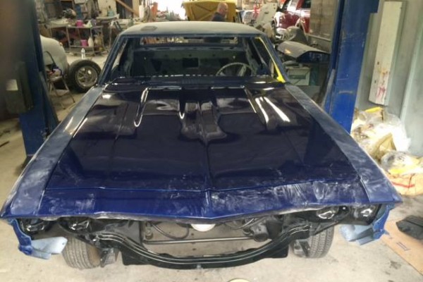 blue 1968 chevelle hood fit check during restoration