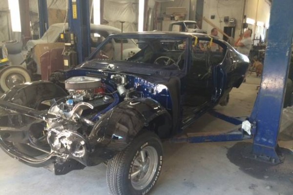 blue 1968 chevelle on lift during restoration