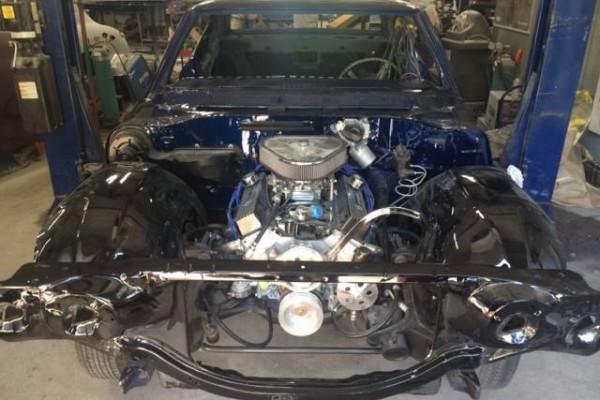 blue 1968 chevelle with engine test fit during restoration