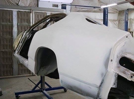 blue 1968 chevelle body in primer prior to paint
