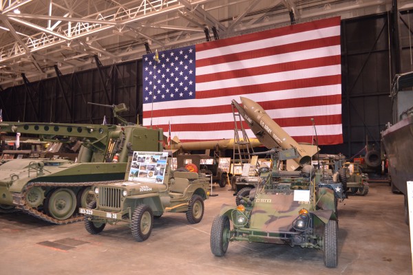 military vehicle display at indoor car show