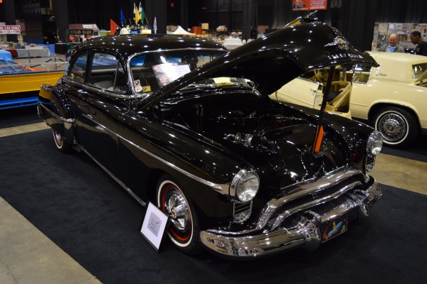 oldsmobile postwar coupe at indoor car show